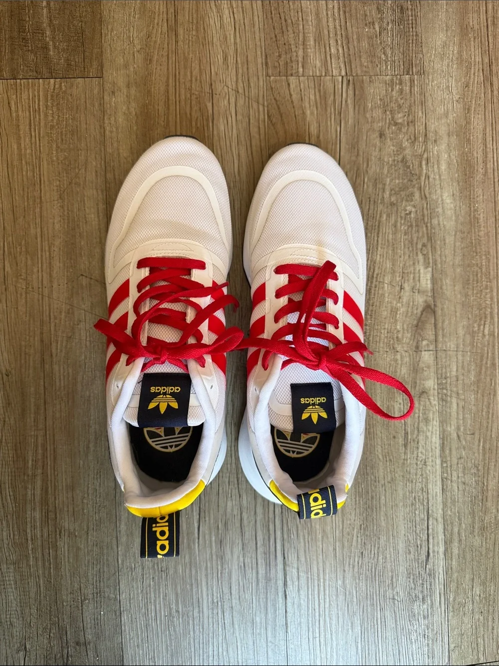 adidas White Sneakers with Red Stripes and Yellow Accents